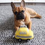 Fabdog NYC Taxi Plush Dog Toy featuring a bright yellow cab design, soft plush exterior, and built-in squeaker, measuring 7 inches.