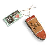 A durable and eco-friendly dog toy made from natural jute and soft suede in the shape of a bullet, perfect for sustainable pet play.