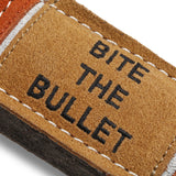 A durable and eco-friendly dog toy made from natural jute and soft suede in the shape of a bullet, perfect for sustainable pet play.