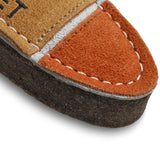 A durable and eco-friendly dog toy made from natural jute and soft suede in the shape of a bullet, perfect for sustainable pet play.