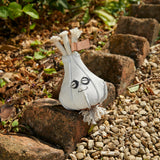 Eco-friendly dog toy shaped like garlic, made from pale grey suede and natural jute fibre, perfect for sustainable and safe pet play.