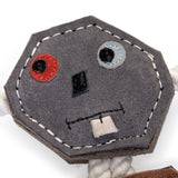 Eco-friendly robot-shaped dog toy made from natural jute and suede with jute rope arms and legs, perfect for safe and sustainable dog playtime.