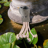 Eco-friendly Olive the Octopus dog toy, made with sustainable jute, soft suede, and a crinkler bottle for added fun.