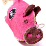 Eco-friendly Peggy the Pig dog toy, made from sustainable jute, suede, and a recycled crinkle bottle for safe, fun playtime.