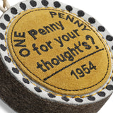Eco-friendly Penny For Your Thoughts dog toy made from sustainable jute and soft suede, safe for dogs to chew and play with.