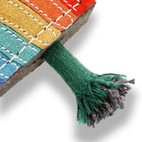 Eco-friendly Rainbow Warrior dog toy made from natural jute and soft suede, featuring rope legs for tugging and fetching fun.
