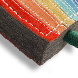 Eco-friendly Rainbow Warrior dog toy made from natural jute and soft suede, featuring rope legs for tugging and fetching fun.