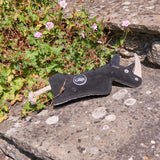 Eco-friendly Ronnie the Rhino dog toy made from jute, recycled cotton, and suede, with a crinkly bottle inside for interactive play.