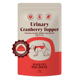 Packet of Hackney Dog House Urinary Cranberry Topper for dogs and cats on a white background