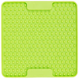 A green LickiMat Soother Mini Cat slow feeding mat for cats with a textured surface designed to slow down feeding.