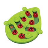 Green Nina Ottosson Buggin' Out cat puzzle with pegs, leaves, and treat compartments for interactive play.