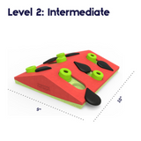 Pink Nina Ottosson Melon Madness cat puzzle with pegs and seed compartments for treat-hunting fun.