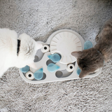 Grey Nina Ottosson Rainy Day cat puzzle with pegs and raindrop-shaped treat compartments for interactive fun.