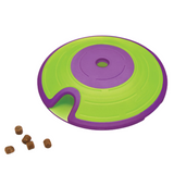 Dog playing with Nina Ottosson Treat Maze interactive puzzle toy, searching for treats.