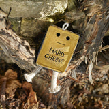 Eco-friendly cheese-shaped dog toy with a suede outer, natural jute stuffing, and jute rope legs, ideal for safe, sustainable play.
