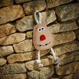 Spud Nik eco-friendly dog toy made from natural jute and soft suede, featuring long jute legs for interactive play.
