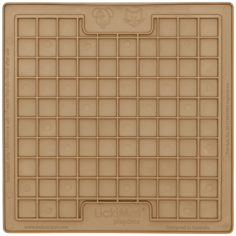 A beige LickiMat Playdate dog and cat treat dispenser with a grid of small compartments.