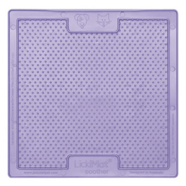 A purple LickiMat Soother slow feeding mat for dogs with a textured surface and handles.